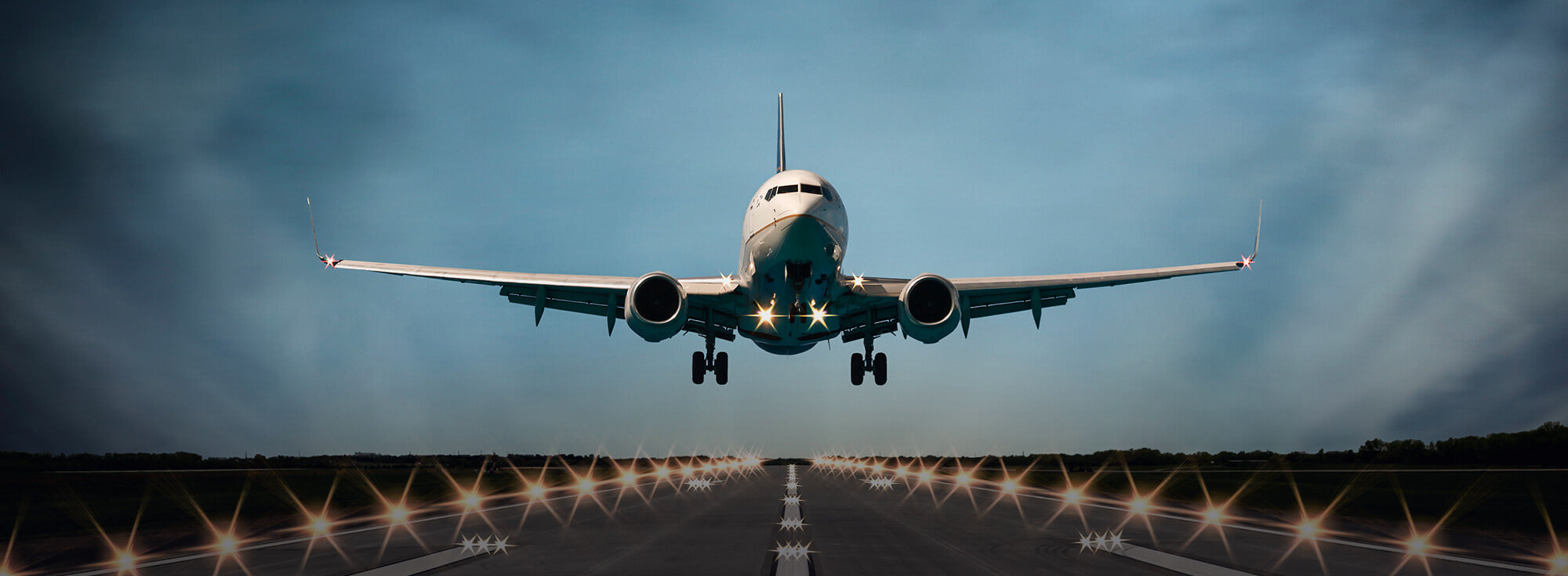 ai-generated image looking down a runway at a commercial passenger plane about to land